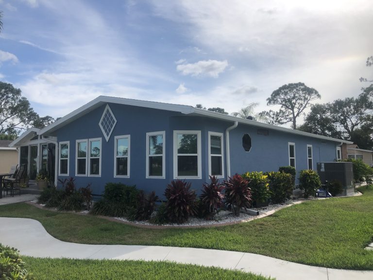 Residential exterior painting finished house in Cape Coral, FL Golden Touch Painting